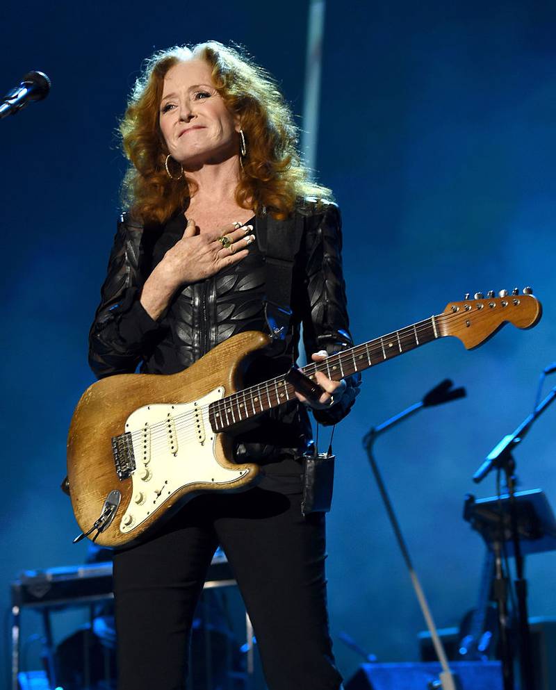 Bonnie Raitt performing on stage