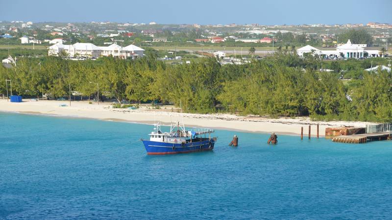 Island surrounded by blue water