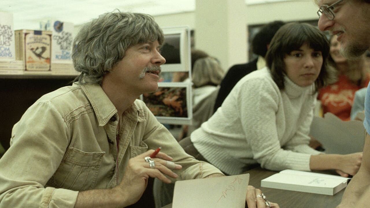 Tom Robbins signs a book for a fan in San Francisco.