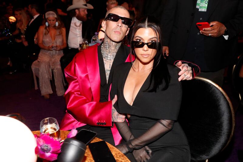 LAS VEGAS, NEVADA - APRIL 03: (L-R) Travis Barker and Kourtney Kardashian toast to the 64th Annual GRAMMY Awards with Grey Goose vodka on April 03, 2022 in Las Vegas, Nevada. (Photo by Jerod Harris/Getty Images for The Recording Academy)