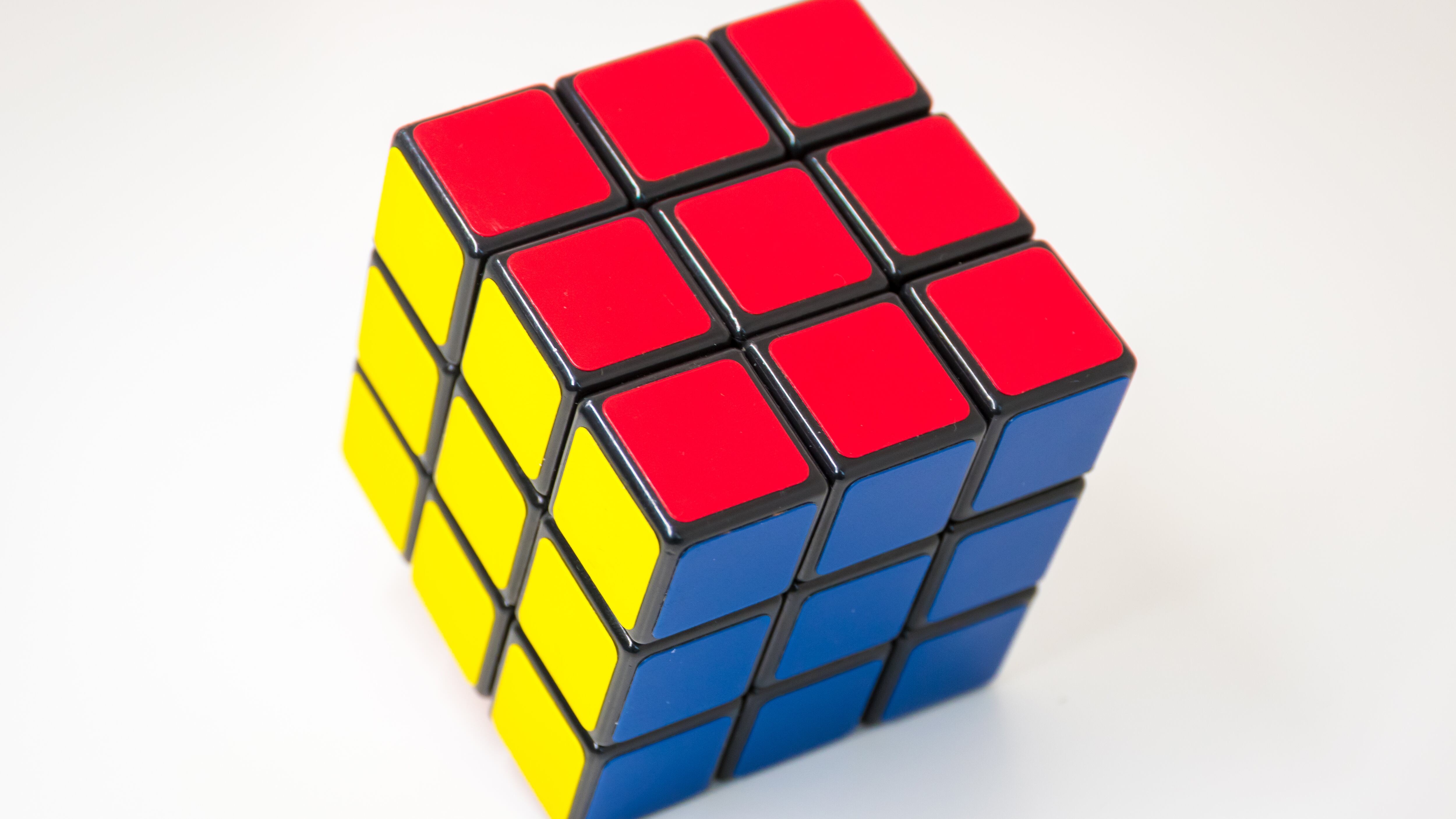 Solved Rubik's Cube 3D puzzle for brain exercise and successful strategies